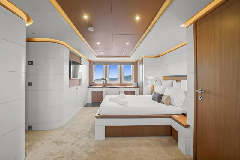 Millesime Yacht Photos Pics Luxurious bedroom interior on 2020 Guy Couach 3700 Fly yacht, featuring modern design and elegant furnishings.