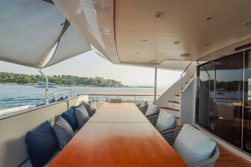 Millesime Yacht Photos Pics Luxurious 2020 Guy Couach 3700 Fly yacht deck with elegant seating and scenic ocean view.