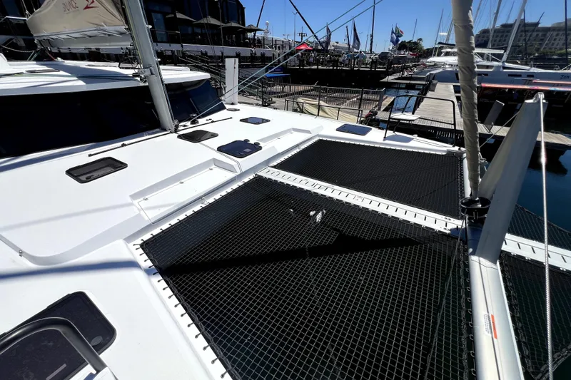 Polpo Yacht Photos Pics 2025 Balance 482 catamaran docked at marina, showcasing deck and netting.