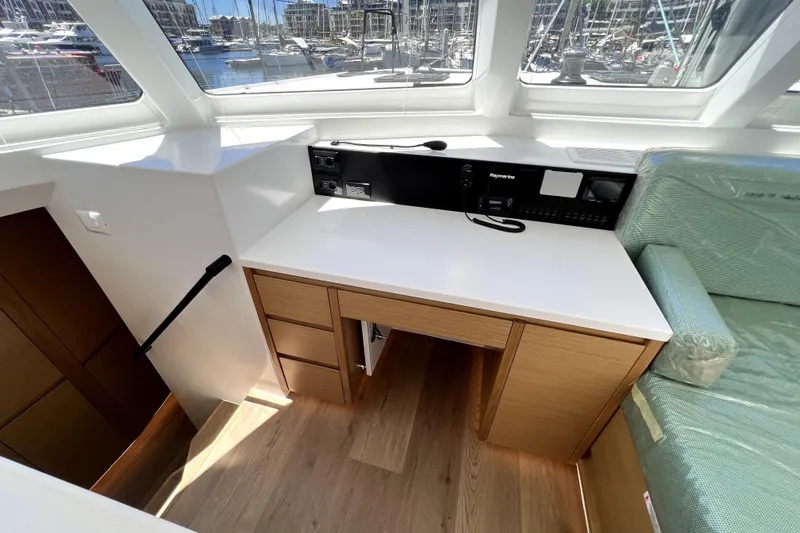 Polpo Yacht Photos Pics Modern yacht interior with navigation station, wood cabinetry, and marina view. Balance 482, 2025 model.
