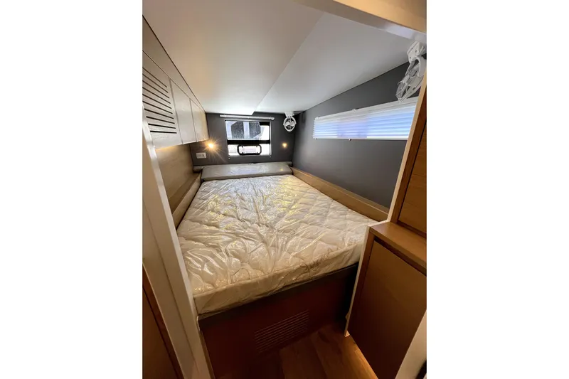 Polpo Yacht Photos Pics Compact bedroom interior in 2025 Balance 482 model, featuring a cozy bed and modern design.