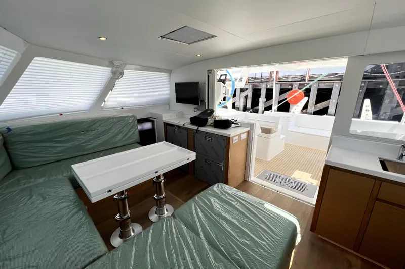 Polpo Yacht Photos Pics Luxurious interior of 2025 Balance 482 yacht with modern seating and sleek design.