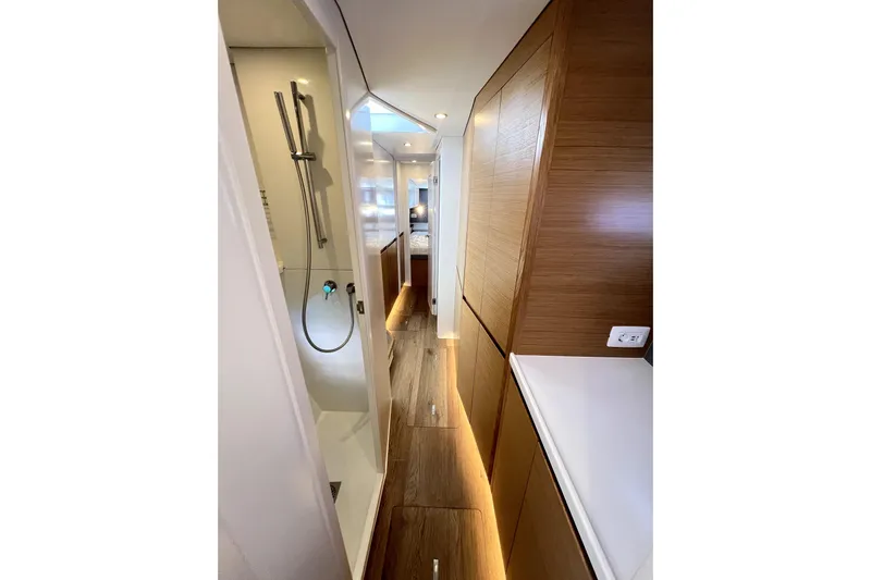Polpo Yacht Photos Pics Modern yacht interior with sleek wood paneling, shower, and ambient lighting, Balance 482, 2025 model.