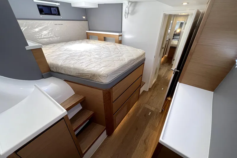 Polpo Yacht Photos Pics Luxurious interior of Balance 482 yacht, featuring a modern bedroom with wooden accents, 2025 model.