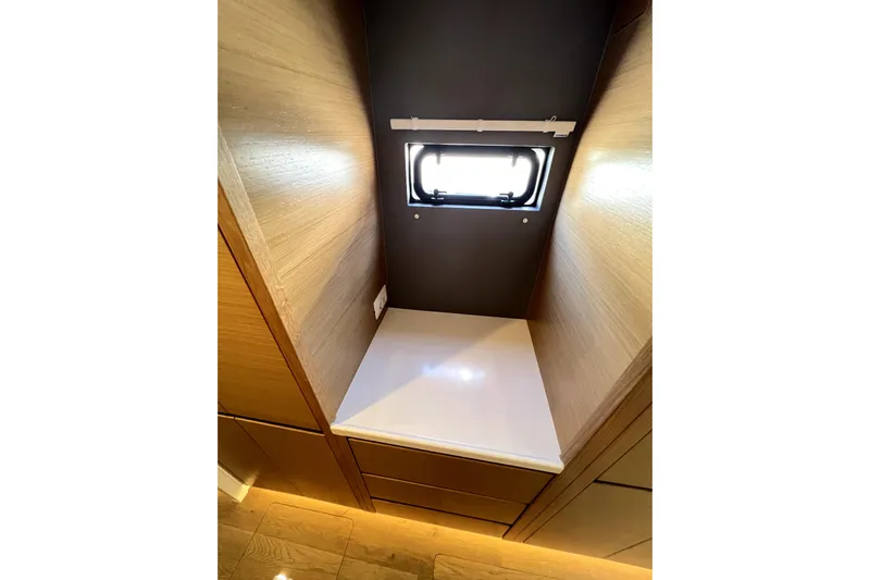 Polpo Yacht Photos Pics Compact wooden interior space with a small window, Balance 482 model, 2025.
