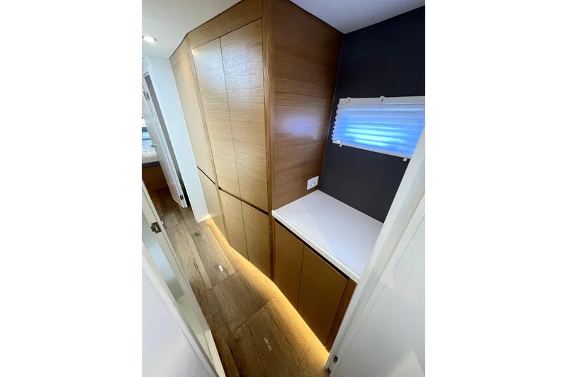 Polpo Yacht Photos Pics Modern interior of Balance 482 yacht, featuring sleek wood cabinetry and ambient lighting, 2025 model.