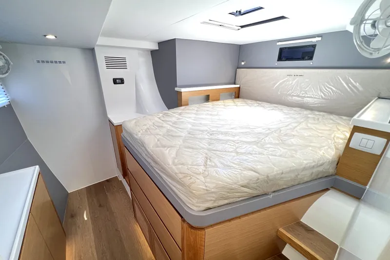 Polpo Yacht Photos Pics Modern bedroom interior in 2025 Balance 482 yacht, featuring a cozy bed and sleek design.