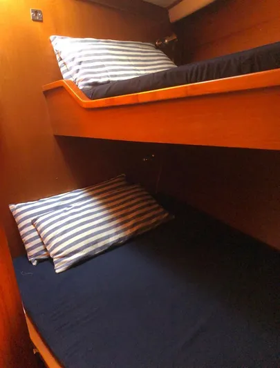 "acamar Iii" Yacht Photos Pics Bunk beds with striped pillows in 1992 Grand Soleil 45 German Frers yacht cabin.