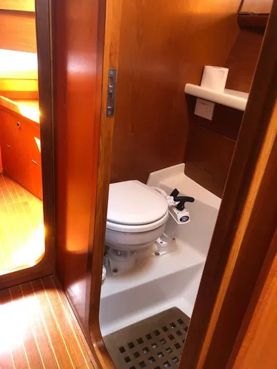 "acamar Iii" Yacht Photos Pics 1992 Grand Soleil 45 German Frers yacht bathroom with wooden interior and marine toilet.
