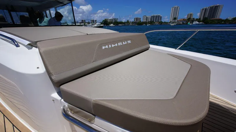 In-stock 2024 Nimbus C11 #082 Yacht Photos Pics 2024 Nimbus Commuter 11 #082 boat with cushioned seating on deck.