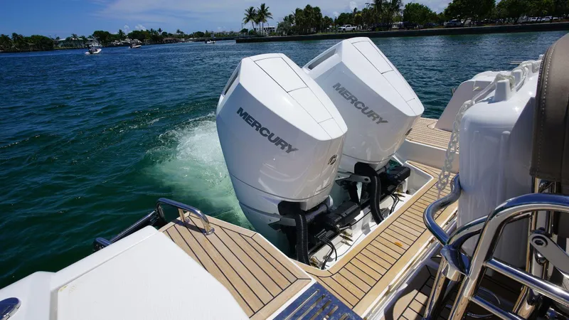 In-stock 2024 Nimbus C11 #082 Yacht Photos Pics 2024 Nimbus Commuter 11 #082 with twin Mercury outboard engines on water.