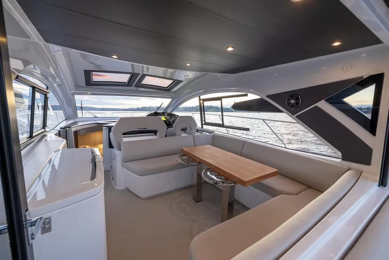 In Stock Yacht Photos Pics 2024 Beneteau Gran Turismo 45 yacht interior with elegant seating and panoramic windows.