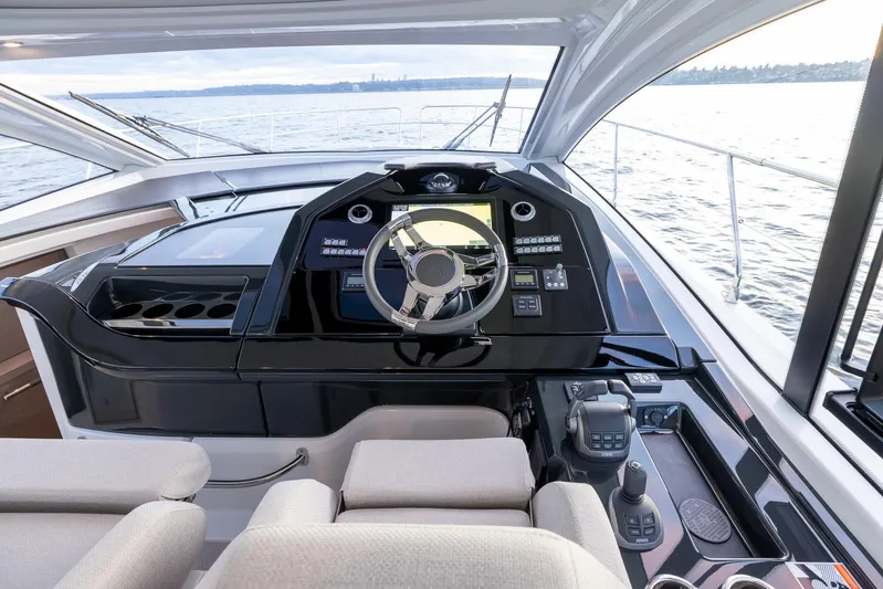 In Stock Yacht Photos Pics 2024 Beneteau Gran Turismo 45 yacht cockpit with modern steering and navigation controls.