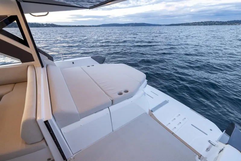 In Stock Yacht Photos Pics 2024 Beneteau Gran Turismo 45 yacht with luxurious deck overlooking serene waters.