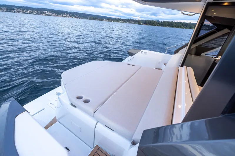 In Stock Yacht Photos Pics 2024 Beneteau Gran Turismo 45 yacht with spacious deck overlooking serene waters.