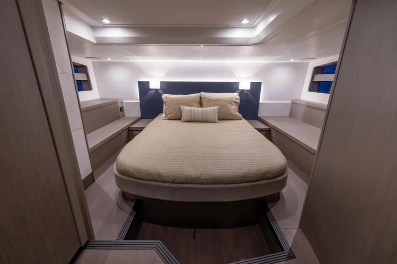 In Stock Yacht Photos Pics Luxurious bedroom interior of 2024 Beneteau Gran Turismo 45 yacht, featuring elegant design and ambient lighting.