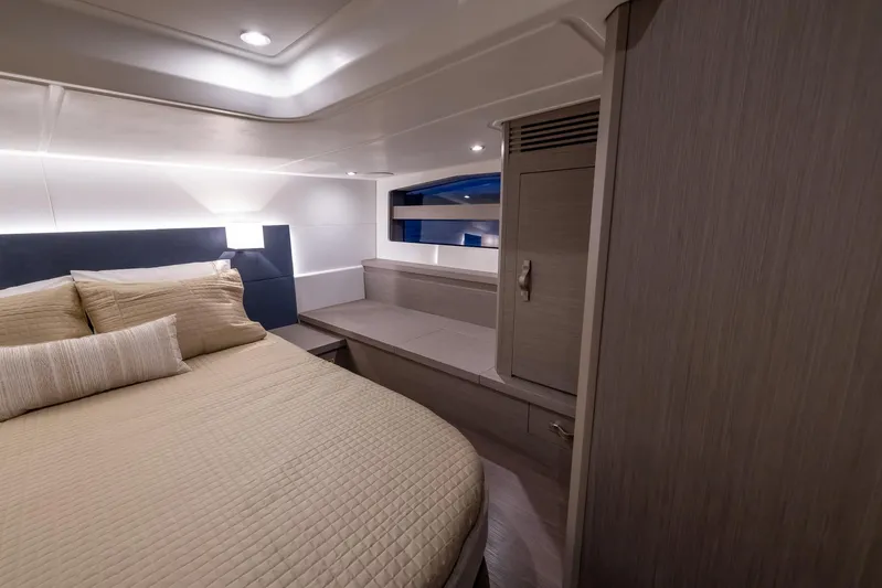 In Stock Yacht Photos Pics 2024 Beneteau Gran Turismo 45 cabin interior with bed and storage.