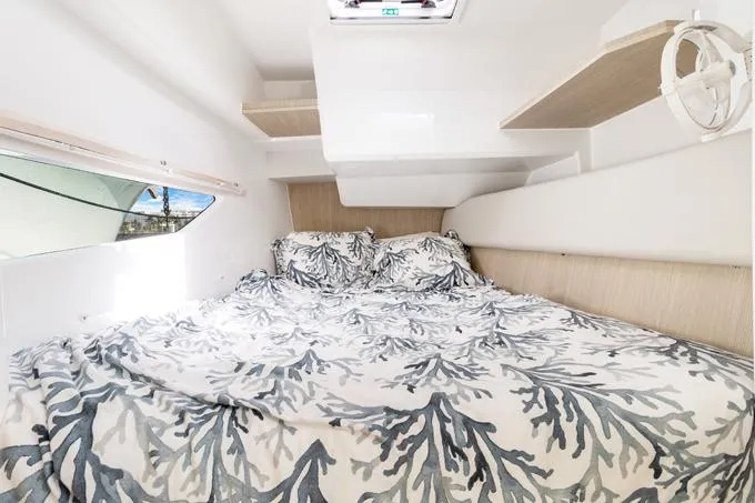 Escape Yacht Photos Pics Interior cabin of 2022 Aquila 36 Sport with patterned bedding and modern design.
