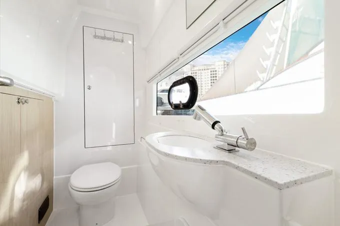 Escape Yacht Photos Pics Modern bathroom interior in 2022 Aquila 36 Sport yacht, featuring sleek design and ocean view.