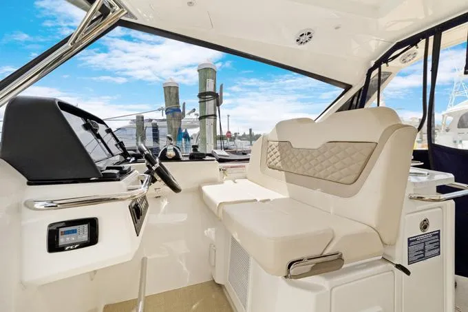 Escape Yacht Photos Pics Interior of 2022 Aquila 36 Sport yacht with modern helm and seating.