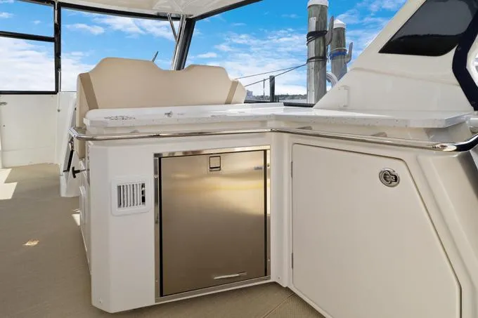 Escape Yacht Photos Pics Aquila 36 Sport 2022 yacht interior with sleek cabinetry and seating.