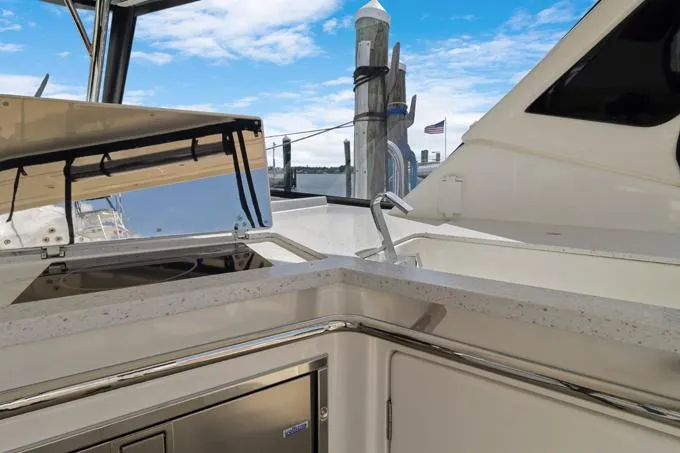 Escape Yacht Photos Pics Aquila 36 Sport 2022 yacht deck with sleek countertop and marina view.