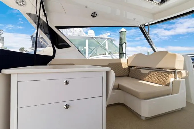 Escape Yacht Photos Pics Interior of 2022 Aquila 36 Sport yacht with beige seating and white cabinetry.