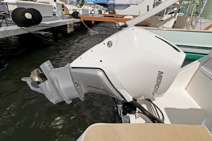 Escape Yacht Photos Pics Outboard motor on 2022 Aquila 36 Sport boat docked at marina.