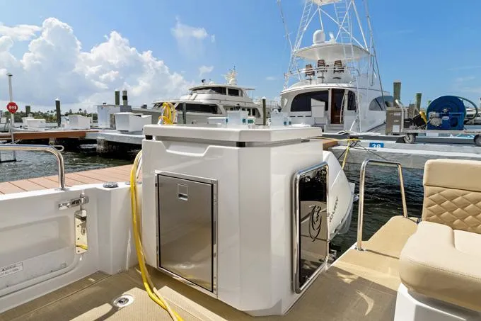 Escape Yacht Photos Pics Aquila 36 Sport 2022 yacht docked at marina with clear skies.