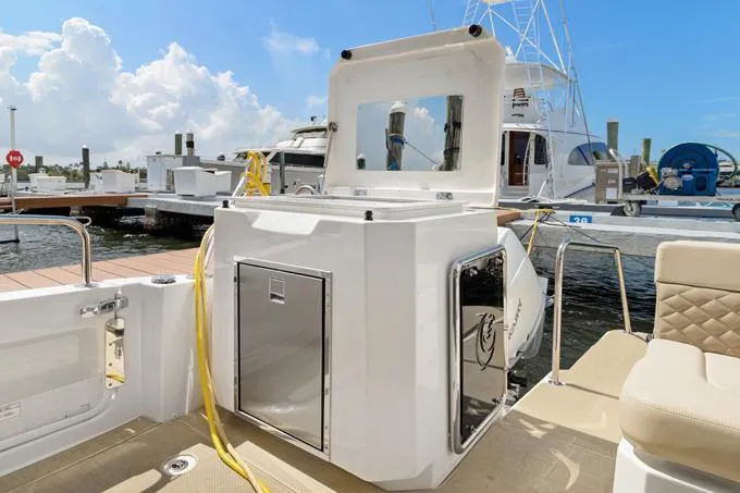 Escape Yacht Photos Pics Aquila 36 Sport 2022 boat docked, featuring sleek design and modern amenities.