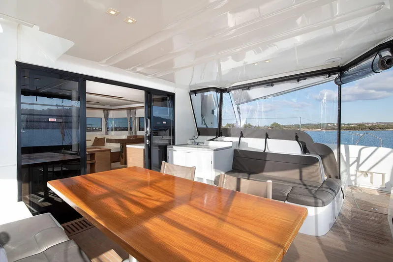  Yacht Photos Pics Luxurious 2022 Lagoon 500 yacht interior with spacious seating and dining area.