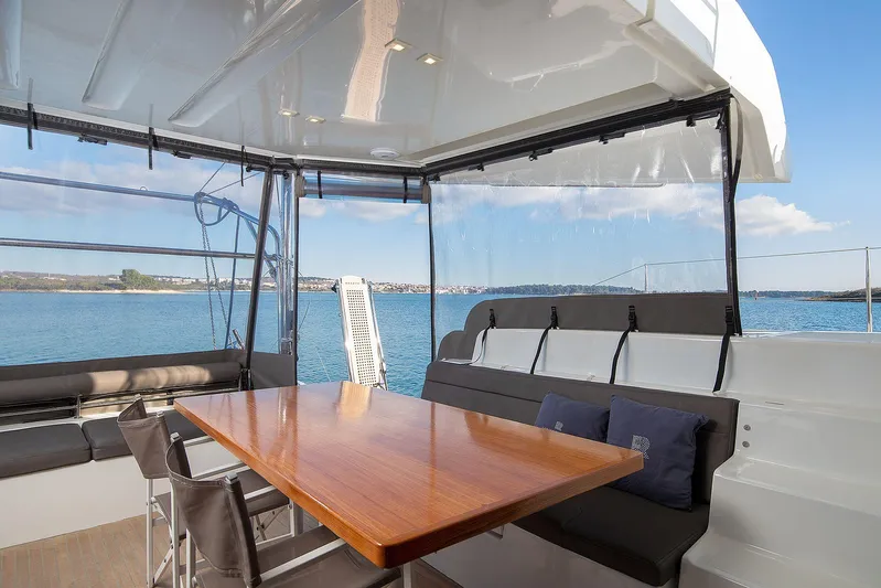  Yacht Photos Pics Luxurious Lagoon 500 yacht interior with dining area, ocean view, 2022 model.