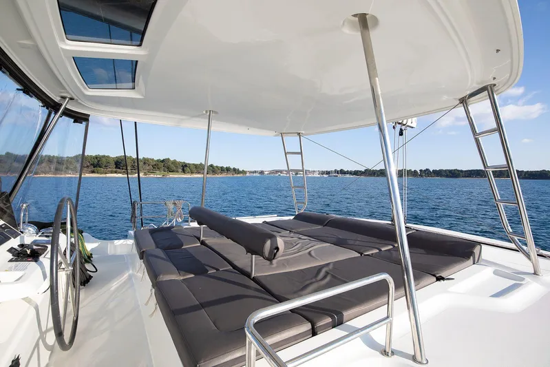  Yacht Photos Pics Luxurious 2022 Lagoon 500 yacht with spacious deck and scenic ocean view.