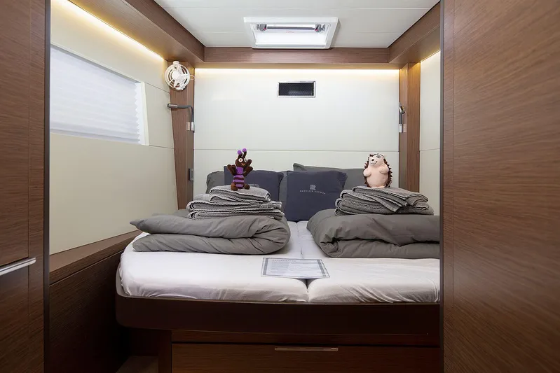  Yacht Photos Pics Luxurious cabin interior of 2022 Lagoon 500 yacht with plush bedding and decor.