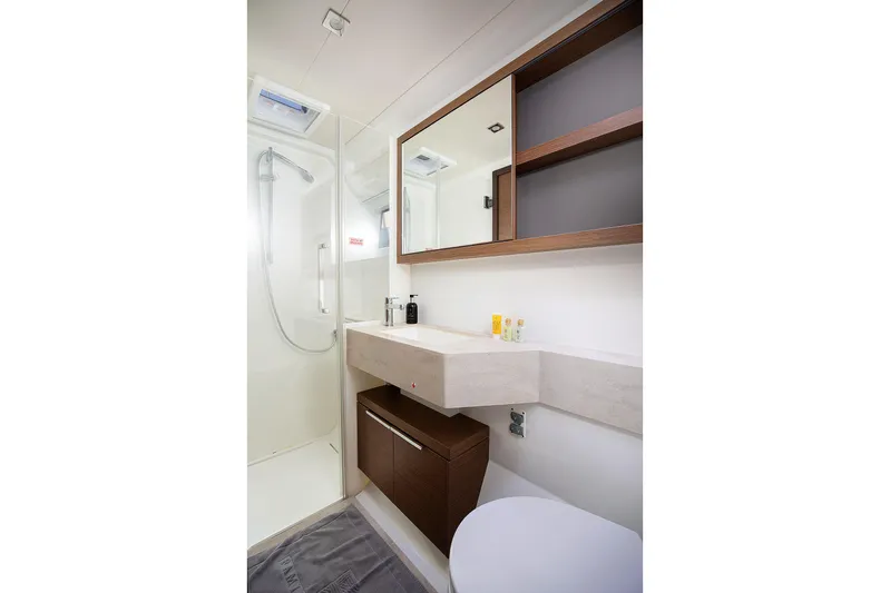  Yacht Photos Pics Modern bathroom interior on 2022 Lagoon 500 yacht, featuring sleek design and amenities.