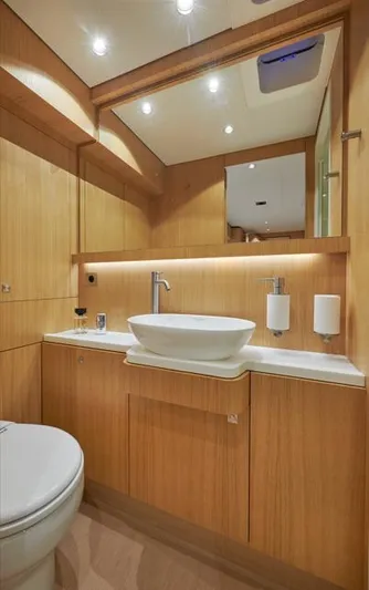 Long Island 78 Yacht Photos Pics Luxury bathroom in 2026 JFA Yachts Long Island 78, featuring modern fixtures and wood accents.