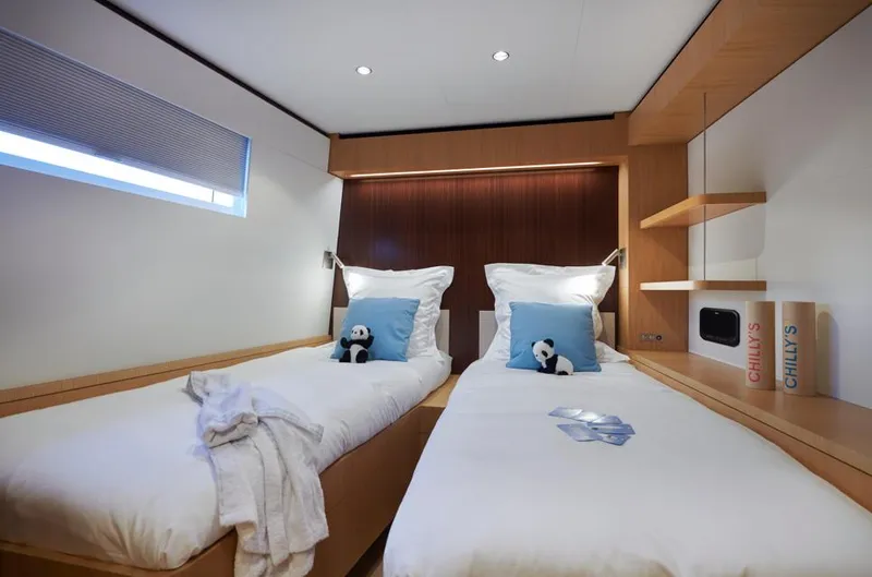 Long Island 78 Yacht Photos Pics Luxurious twin cabin on 2026 JFA Yachts Long Island 78, featuring modern design and plush bedding.