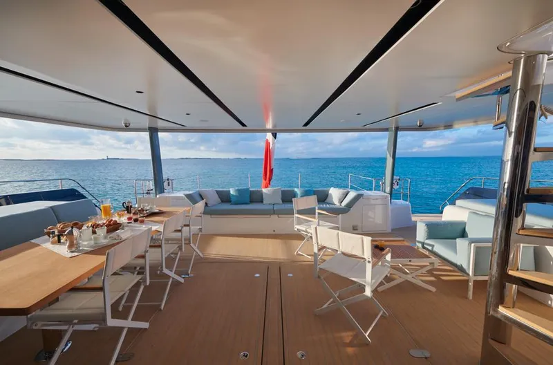 Long Island 78 Yacht Photos Pics Luxurious deck of 2026 JFA Yachts Long Island 78, featuring elegant seating and ocean views.