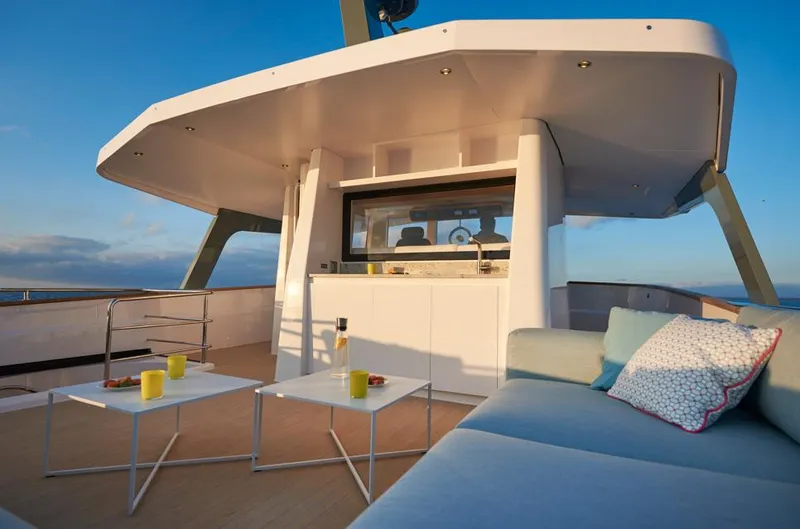 Long Island 78 Yacht Photos Pics Luxurious deck of 2026 JFA Yachts Long Island 78 with modern seating and tables.