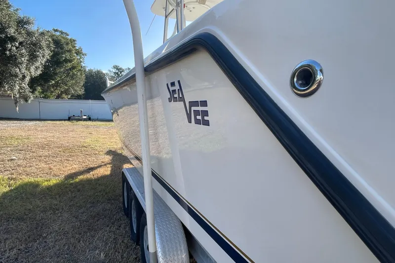 Steph-lo Yacht Photos Pics 2004 SeaVee 320i Cuddy boat side view, parked on grass.