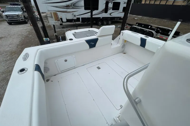 Steph-lo Yacht Photos Pics 2004 SeaVee 320i Cuddy boat deck with white seating and storage compartments.