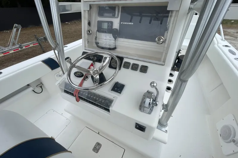 Steph-lo Yacht Photos Pics 2004 SeaVee 320i Cuddy boat helm with steering wheel and navigation controls.