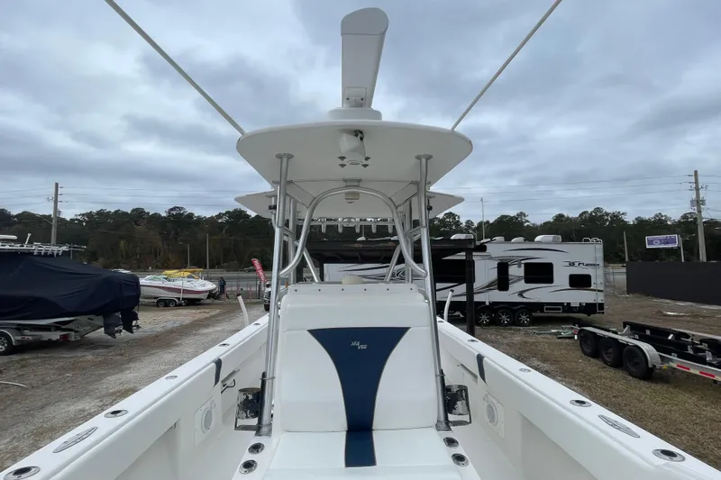 Steph-lo Yacht Photos Pics 2004 SeaVee 320i Cuddy boat, white interior, parked outdoors with trailers and RVs nearby.