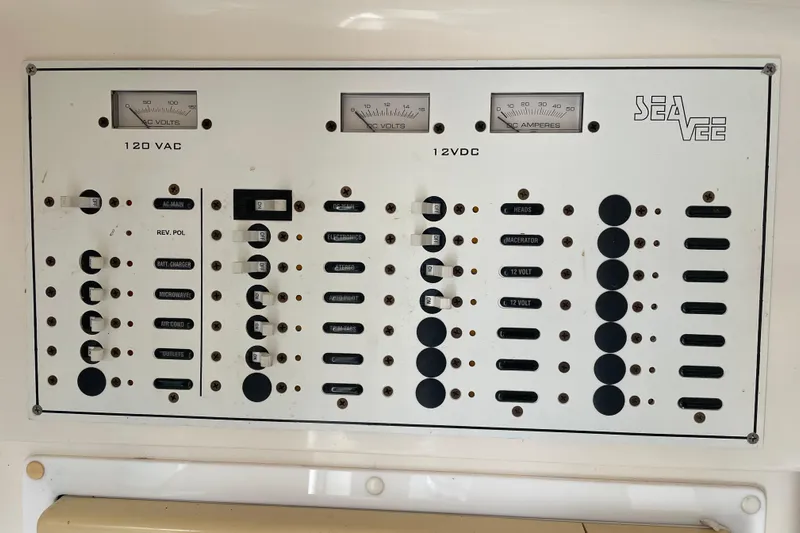 Steph-lo Yacht Photos Pics Electrical panel of a 2004 SeaVee 320i Cuddy boat, featuring 120 VAC and 12 VDC controls.