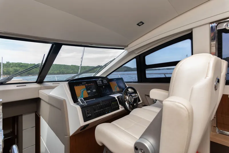 Janie Yacht Photos Pics Interior view of 2018 Sea Ray L650 Fly cockpit with controls.