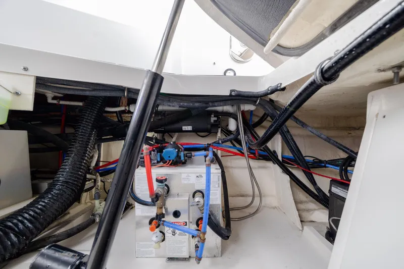  Yacht Photos Pics Engine compartment of 2020 Sea Ray Sundancer 320 Outboard with visible wiring and components.