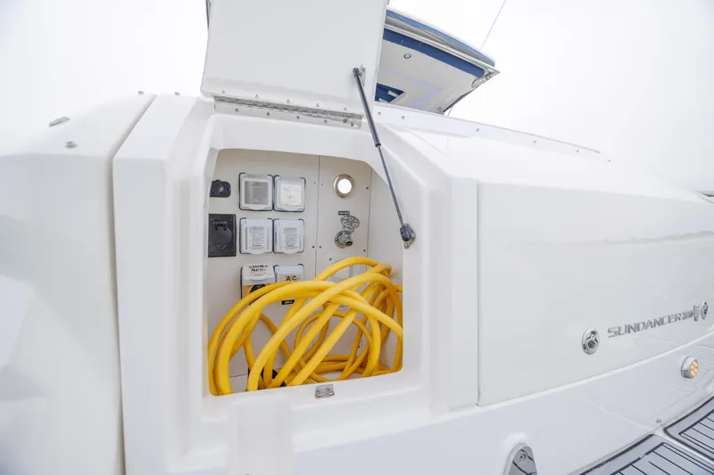  Yacht Photos Pics 2020 Sea Ray Sundancer 320 Outboard electrical compartment with yellow cables and control panel.