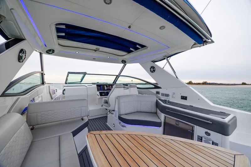  Yacht Photos Pics Luxurious interior of 2020 Sea Ray Sundancer 320 Outboard with elegant seating and modern amenities.