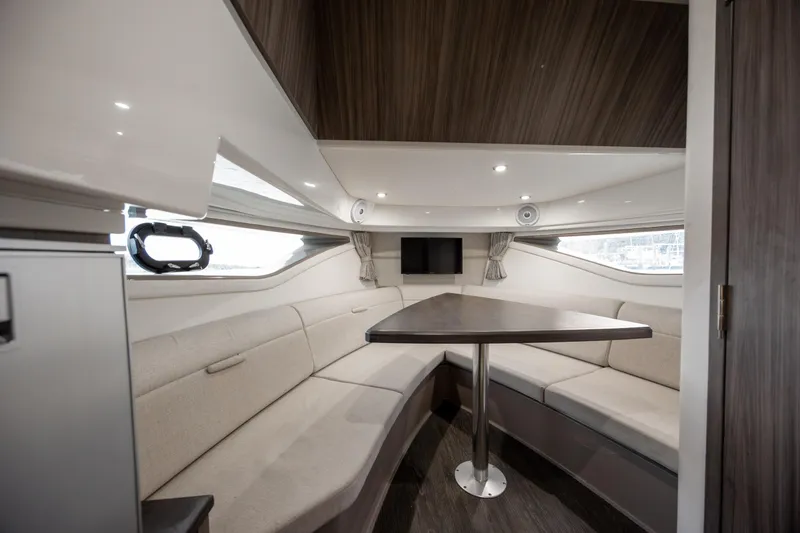  Yacht Photos Pics 2020 Sea Ray Sundancer 320 Outboard interior with cozy seating and modern design.