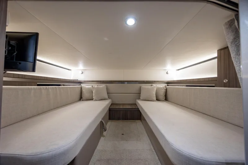 Yacht Photos Pics Interior cabin of 2020 Sea Ray Sundancer 320 Outboard, featuring cozy seating and modern design.